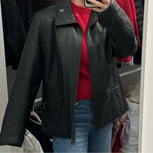 Large but fits like small/medium leather jacket real